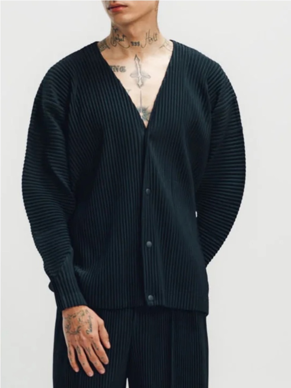 Issey Miyake Homme Plisse  
pleated V-neck cardigan in grey.